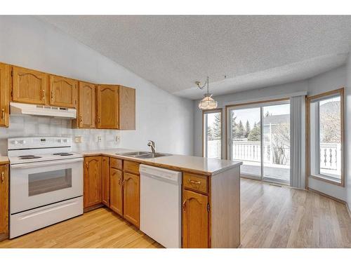273 Woodside Road Nw, Airdrie, AB - Indoor Photo Showing Kitchen With Double Sink