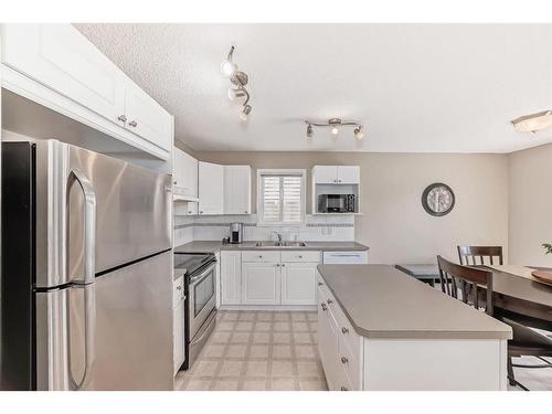 62 Taracove Road Ne, Calgary, AB - Indoor Photo Showing Kitchen With Double Sink