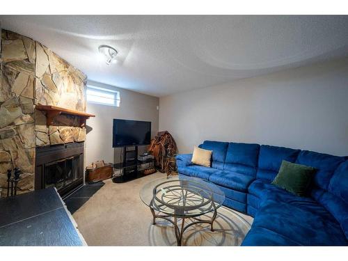 76 Lake Huron Place Se, Calgary, AB - Indoor Photo Showing Living Room With Fireplace
