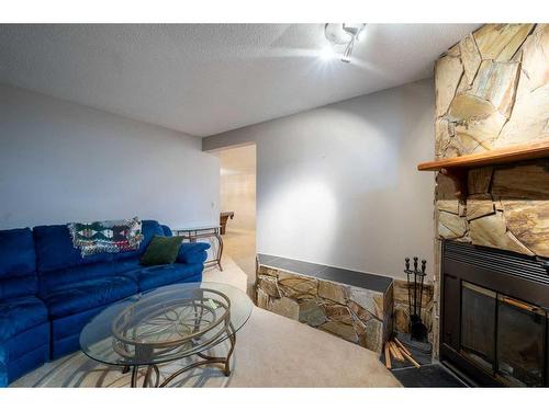 76 Lake Huron Place Se, Calgary, AB - Indoor Photo Showing Living Room With Fireplace