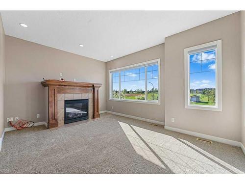 580 Cranston Drive Se, Calgary, AB - Indoor Photo Showing Other Room With Fireplace