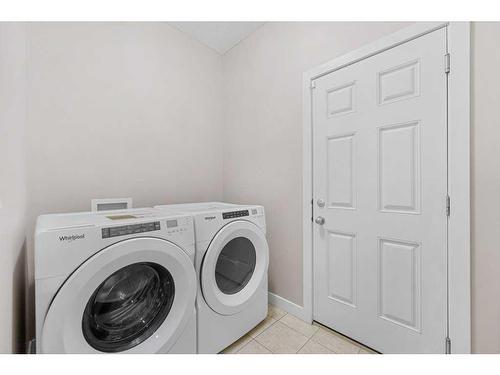 580 Cranston Drive Se, Calgary, AB - Indoor Photo Showing Laundry Room