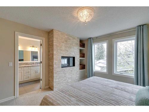 431 23 Avenue Nw, Calgary, AB - Indoor Photo Showing Bedroom With Fireplace