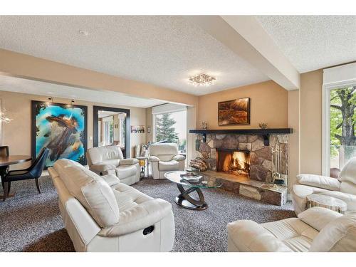 200-80054 226 Avenue West, Rural Foothills County, AB - Indoor Photo Showing Living Room With Fireplace