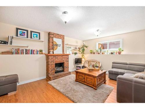 56 Brookpark Place Sw, Calgary, AB - Indoor Photo Showing Living Room With Fireplace
