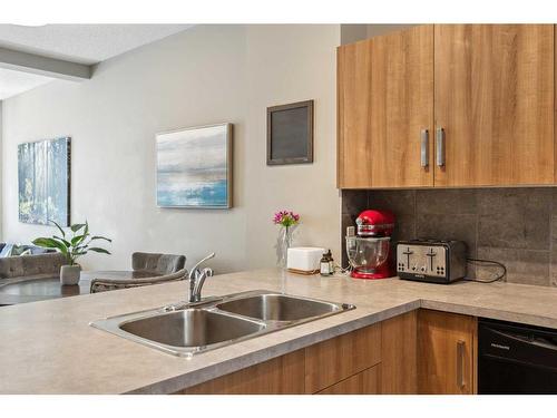 220 New Brighton Row Se, Calgary, AB - Indoor Photo Showing Kitchen With Double Sink