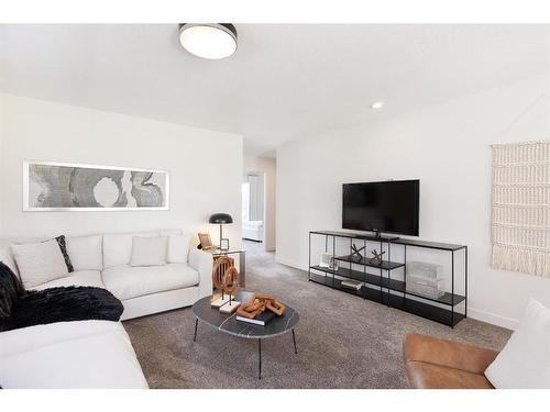 7 Midgrove Drive Sw, Airdrie, AB - Indoor Photo Showing Living Room