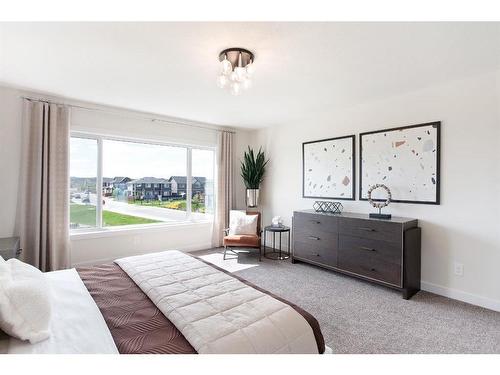 7 Midgrove Drive Sw, Airdrie, AB - Indoor Photo Showing Bedroom