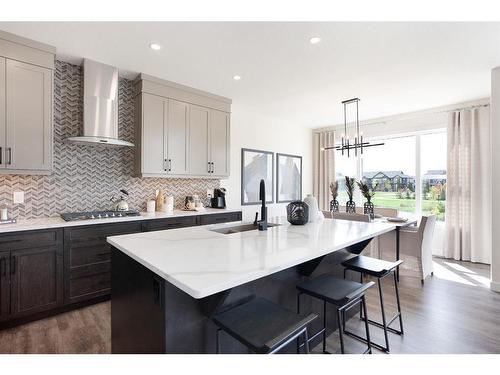 7 Midgrove Drive Sw, Airdrie, AB - Indoor Photo Showing Kitchen With Upgraded Kitchen