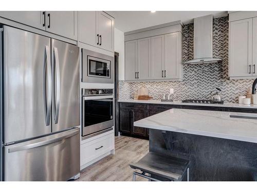 7 Midgrove Drive Sw, Airdrie, AB - Indoor Photo Showing Kitchen With Upgraded Kitchen