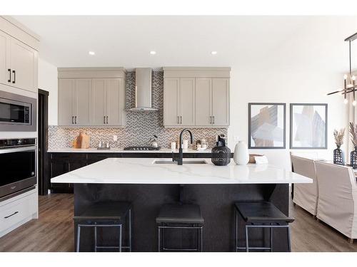 7 Midgrove Drive Sw, Airdrie, AB - Indoor Photo Showing Kitchen With Upgraded Kitchen