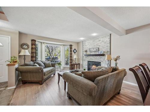 247 Edgebrook Circle Nw, Calgary, AB - Indoor Photo Showing Living Room With Fireplace