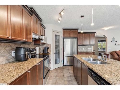40 Chapalina Common Se, Calgary, AB - Indoor Photo Showing Kitchen With Double Sink
