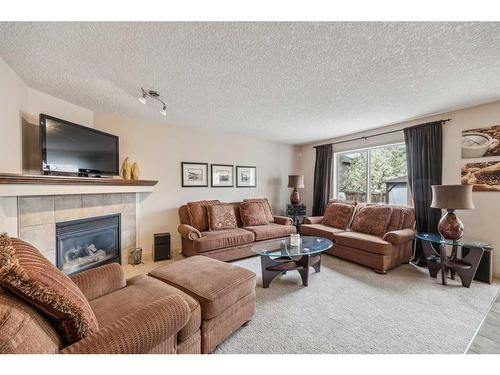 40 Chapalina Common Se, Calgary, AB - Indoor Photo Showing Living Room With Fireplace