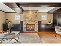 2336 Uxbridge Drive Nw, Calgary, AB  - Indoor Photo Showing Living Room With Fireplace 