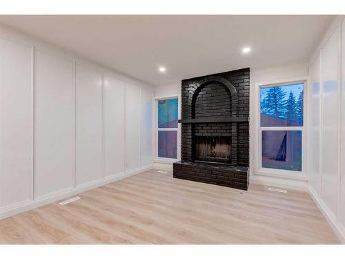 151 Midglen Place Se, Calgary, AB - Indoor Photo Showing Living Room With Fireplace