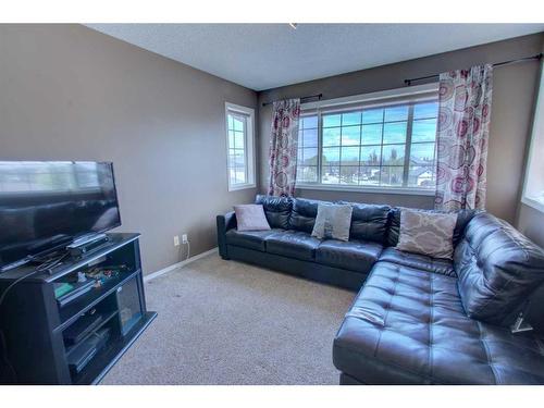 418 Bridlewood Place Sw, Calgary, AB - Indoor Photo Showing Living Room