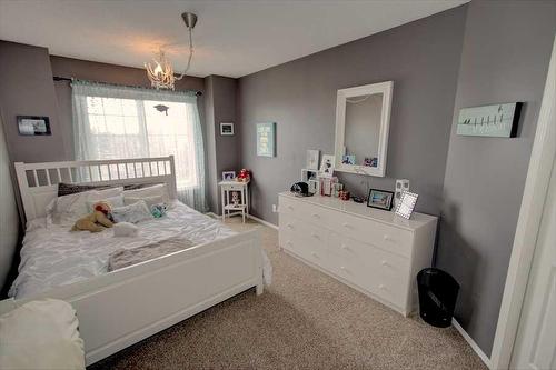 418 Bridlewood Place Sw, Calgary, AB - Indoor Photo Showing Bedroom