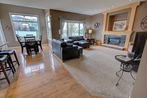 418 Bridlewood Place Sw, Calgary, AB - Indoor Photo Showing Living Room With Fireplace