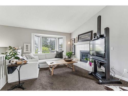 47 Shawbrooke Crescent Sw, Calgary, AB - Indoor Photo Showing Living Room With Fireplace