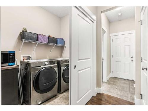 366 Silverado Way Sw, Calgary, AB - Indoor Photo Showing Laundry Room