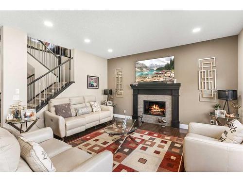 366 Silverado Way Sw, Calgary, AB - Indoor Photo Showing Living Room With Fireplace