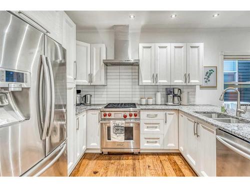 905 20 Avenue Se, Calgary, AB - Indoor Photo Showing Kitchen With Double Sink With Upgraded Kitchen