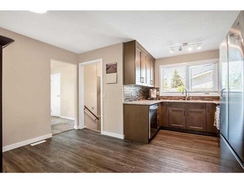 12 Penswood Place Se, Calgary, AB - Indoor Photo Showing Kitchen With Double Sink