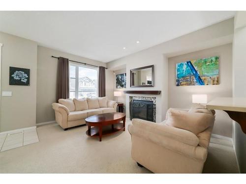 199 Chapalina Square Se, Calgary, AB - Indoor Photo Showing Living Room With Fireplace