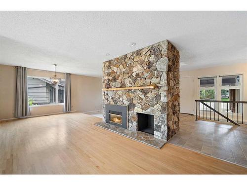 104 Midridge Close Se, Calgary, AB - Indoor Photo Showing Living Room With Fireplace
