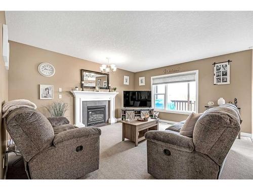 87 Bridlecrest Street Sw, Calgary, AB - Indoor Photo Showing Living Room With Fireplace