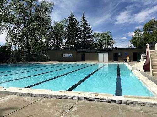 403-3375 15 Street Sw, Calgary, AB - Outdoor With In Ground Pool With Backyard
