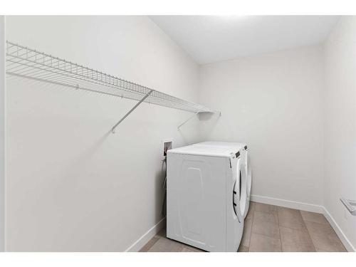 36 Carringvue Passage Nw, Calgary, AB - Indoor Photo Showing Laundry Room