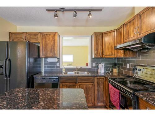 119 Hidden Creek Cove Nw, Calgary, AB - Indoor Photo Showing Kitchen With Double Sink