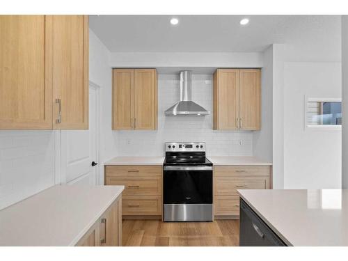 187 Baneberry Way Sw, Airdrie, AB - Indoor Photo Showing Kitchen