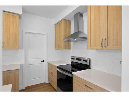 187 Baneberry Way Sw, Airdrie, AB - Indoor Photo Showing Kitchen