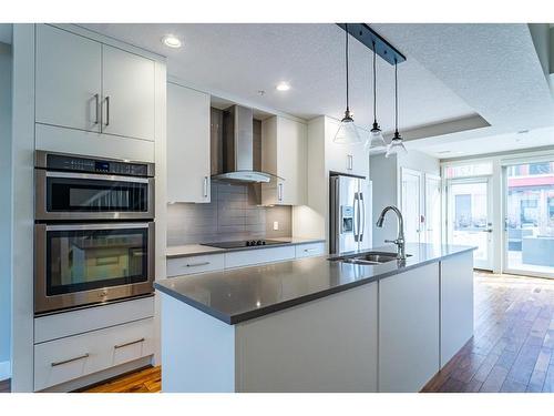 210-2717 17 Street Sw, Calgary, AB - Indoor Photo Showing Kitchen With Stainless Steel Kitchen With Double Sink With Upgraded Kitchen