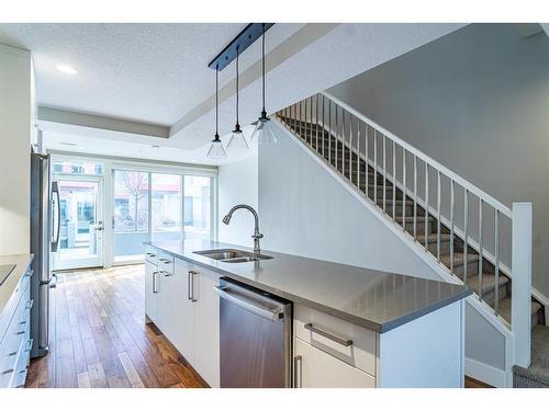 210-2717 17 Street Sw, Calgary, AB - Indoor Photo Showing Kitchen With Double Sink With Upgraded Kitchen