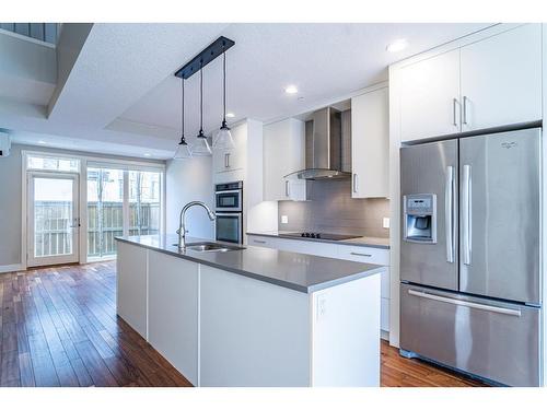 210-2717 17 Street Sw, Calgary, AB - Indoor Photo Showing Kitchen With Stainless Steel Kitchen With Double Sink With Upgraded Kitchen