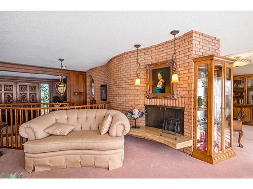 2945 Toronto Crescent Nw, Calgary, AB - Indoor Photo Showing Living Room With Fireplace