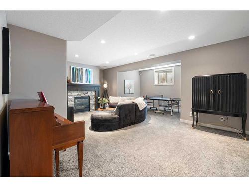 96 Mike Ralph Way Sw, Calgary, AB - Indoor With Fireplace