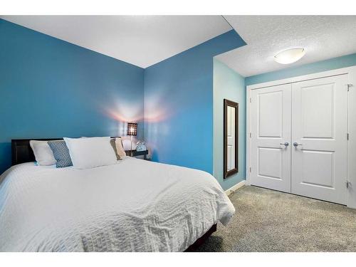 96 Mike Ralph Way Sw, Calgary, AB - Indoor Photo Showing Bedroom