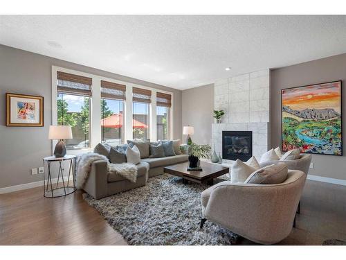 96 Mike Ralph Way Sw, Calgary, AB - Indoor Photo Showing Living Room With Fireplace