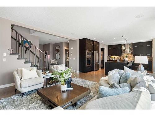 96 Mike Ralph Way Sw, Calgary, AB - Indoor Photo Showing Living Room