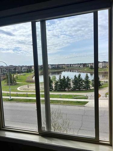 319-15 Saddlestone Way Ne, Calgary, AB - Indoor Photo Showing Other Room With Body Of Water