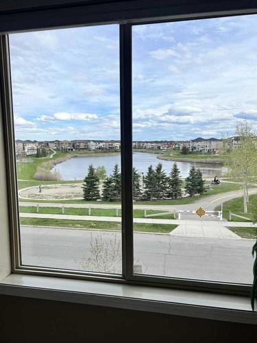 319-15 Saddlestone Way Ne, Calgary, AB - Indoor Photo Showing Other Room With Body Of Water