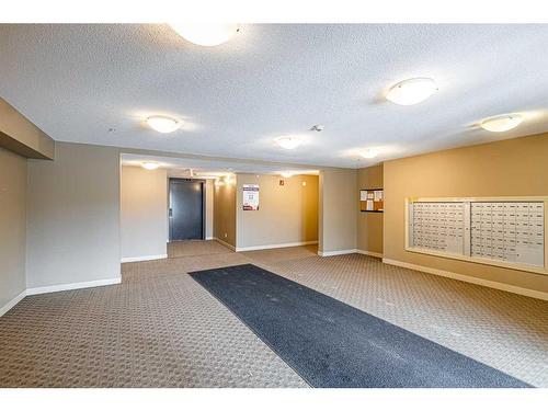 319-15 Saddlestone Way Ne, Calgary, AB - Indoor Photo Showing Other Room