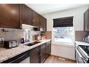 250 Covecreek Circle Ne, Calgary, AB  - Indoor Photo Showing Kitchen With Double Sink With Upgraded Kitchen 
