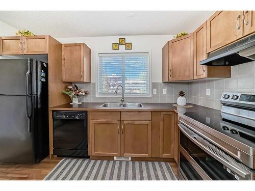 233 Eversyde Boulevard Sw, Calgary, AB - Indoor Photo Showing Kitchen With Double Sink