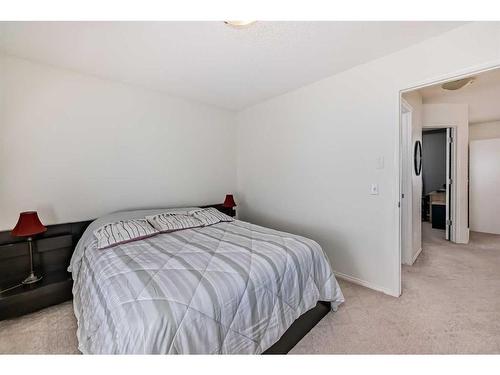 233 Eversyde Boulevard Sw, Calgary, AB - Indoor Photo Showing Bedroom